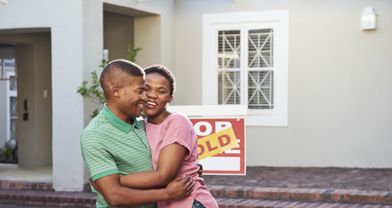 Couple celebrating buying a house