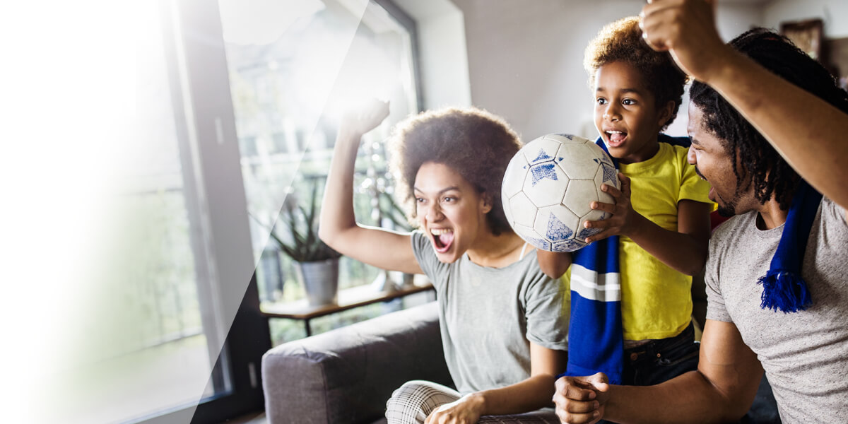 Family watching soccer together