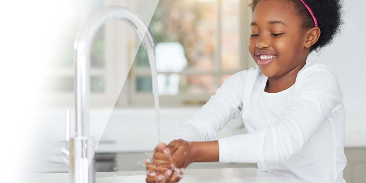 Girl washing her hands