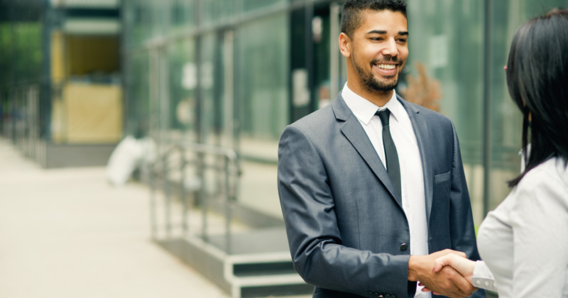 Man and woman shaking hands